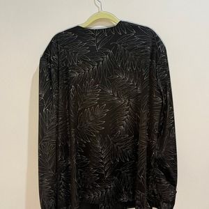 Sparkly black top with leaves pattern